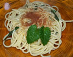 Botargo spaghetti with balm leaves